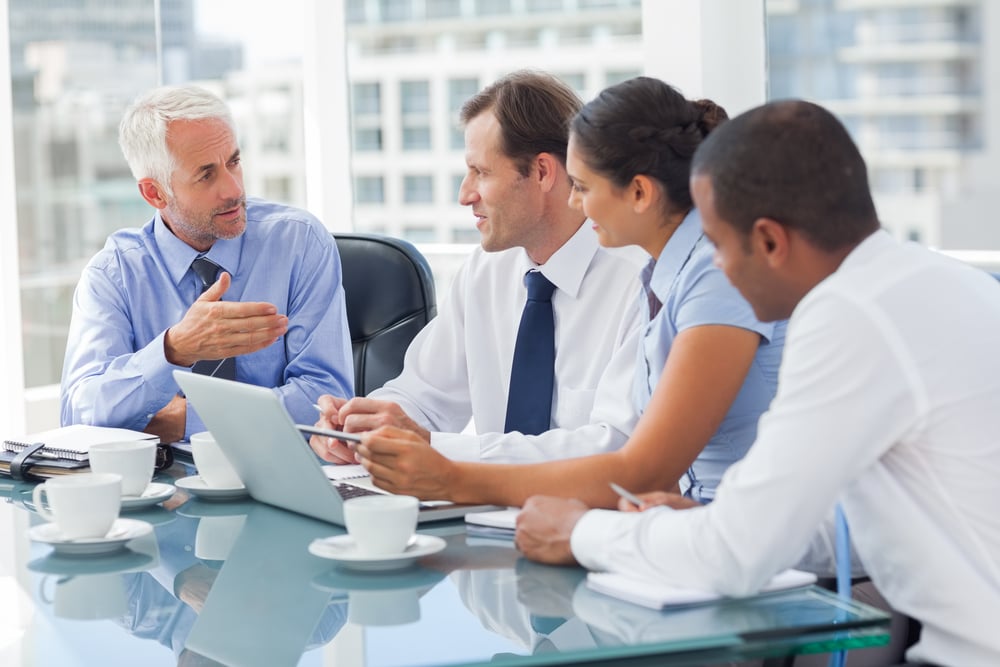 Group of business people brainstorming together in the meeting room Group of business people brainstorming together in the meeting room