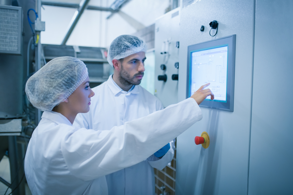 Food technicians working together in a food processing plant-1 Food technicians working together in a food processing plant-1